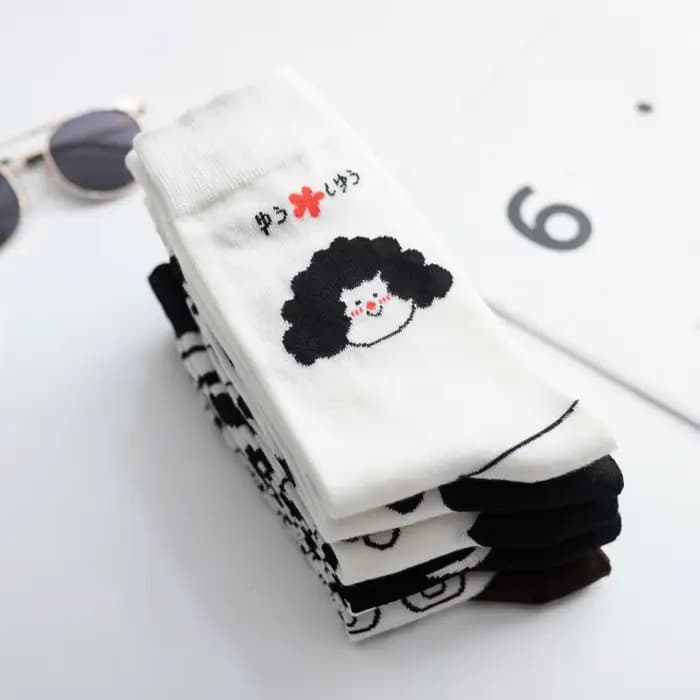 Chaussettes noires et blanches pour femmes, marque Ins Tide, chaussettes japonaises mignonnes avec Illustration de dessin animé, tête humaine, chaussettes de Skateboard
