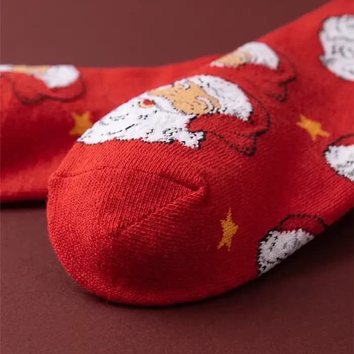 1 paire de chaussettes unisexes avec semelles rouges festives ornées de motifs Père Noël et d'étoiles