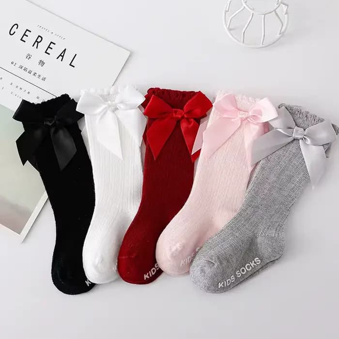 Chaussettes Tube hautes avec nœud papillon rouge