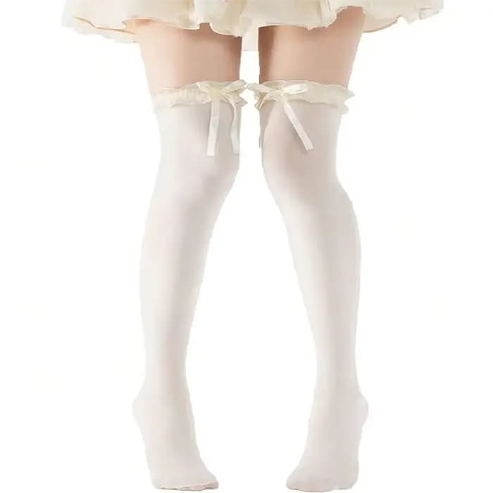 1 paire de collants en dentelle au-dessus du genou avec nœuds papillon