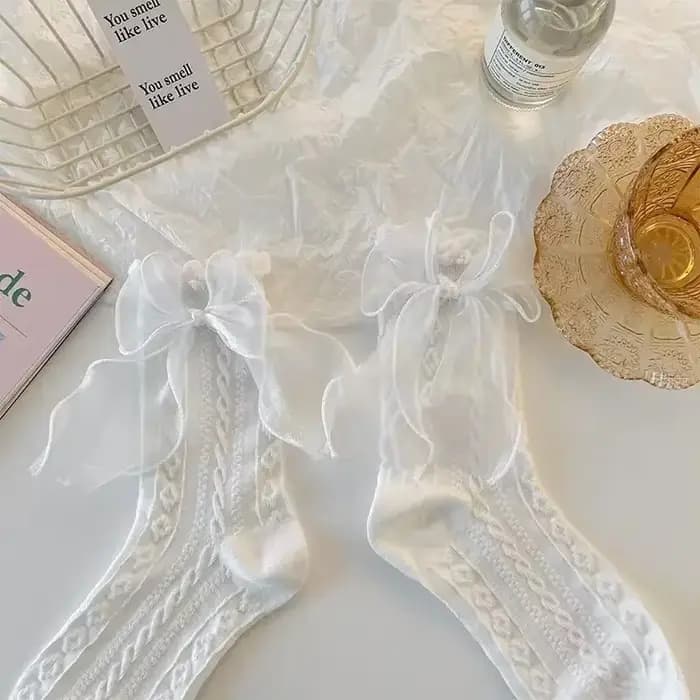 Chaussettes mi-tube en dentelle unie avec nœud à volants
