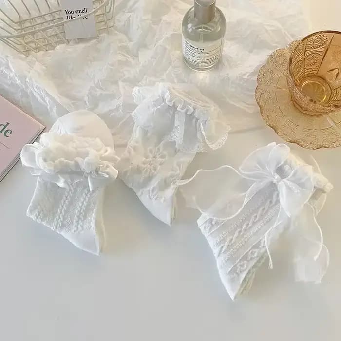 Chaussettes mi-tube en dentelle unie avec nœud à volants
