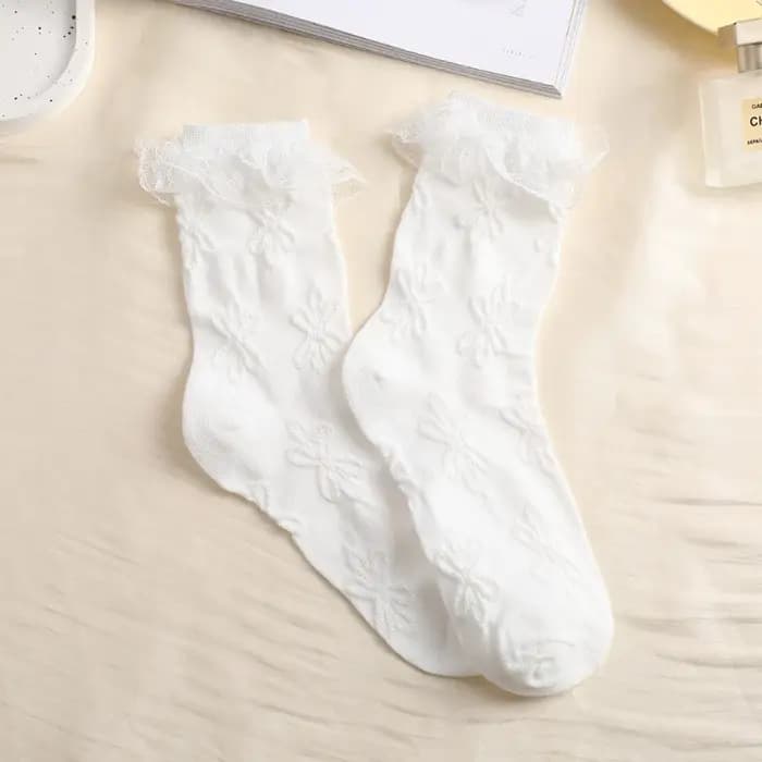 Chaussettes mi-tube en dentelle unie avec nœud à volants